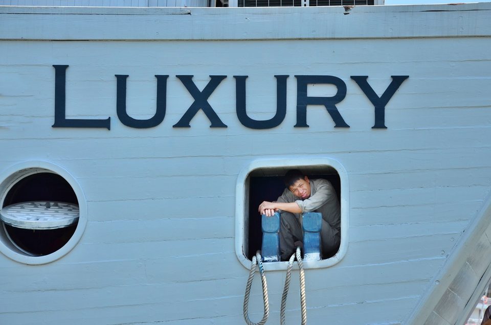 a Vietnamese worker on Halong Bay tourist ship, VIETNAM