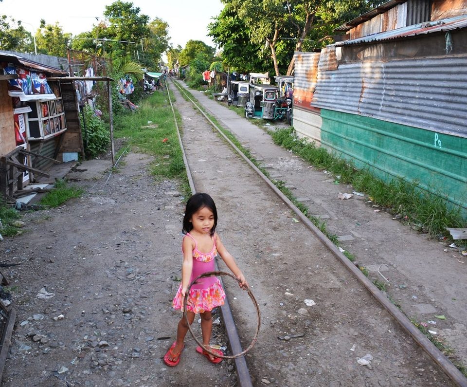 Living on the railway, a girl and her hula hoop