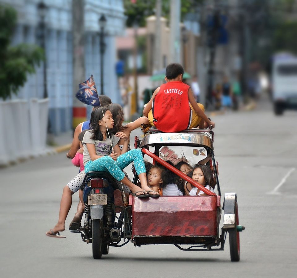 11 travelers and one tricycle, popular way of transportation in Philippines