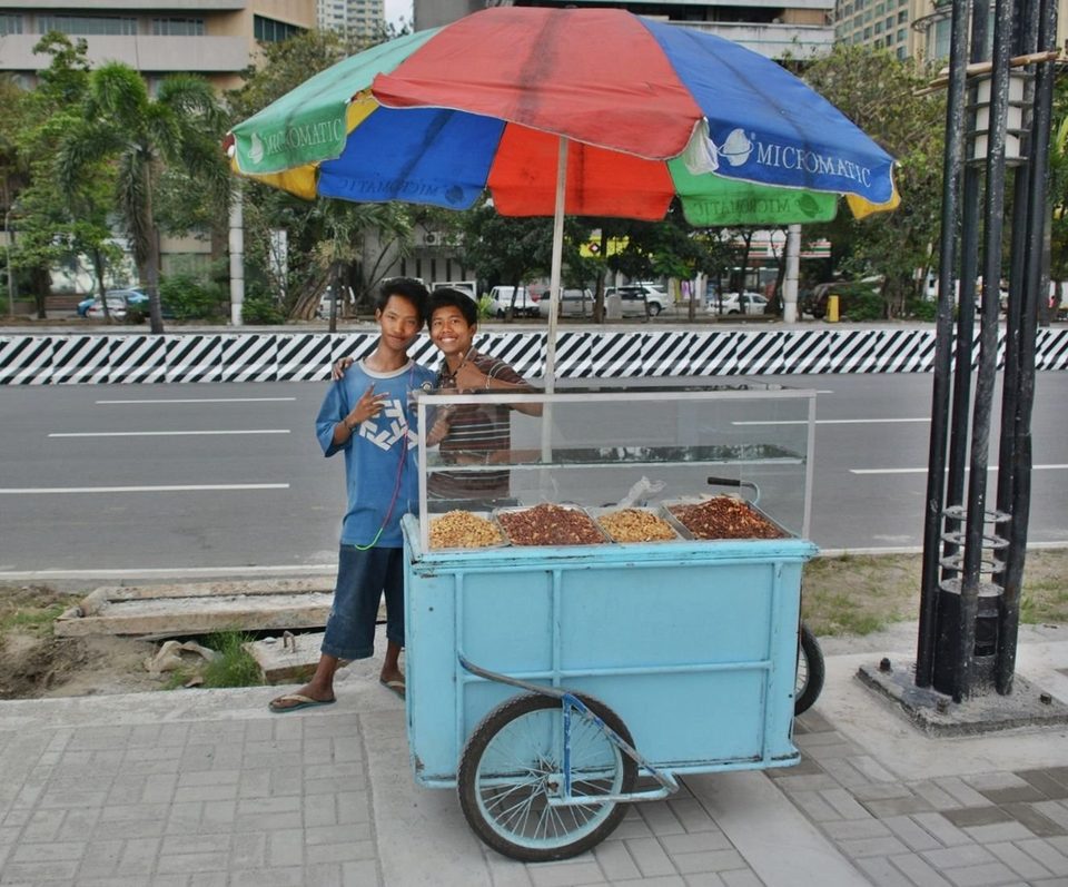 PHILIPPINES - Street sellers and their store