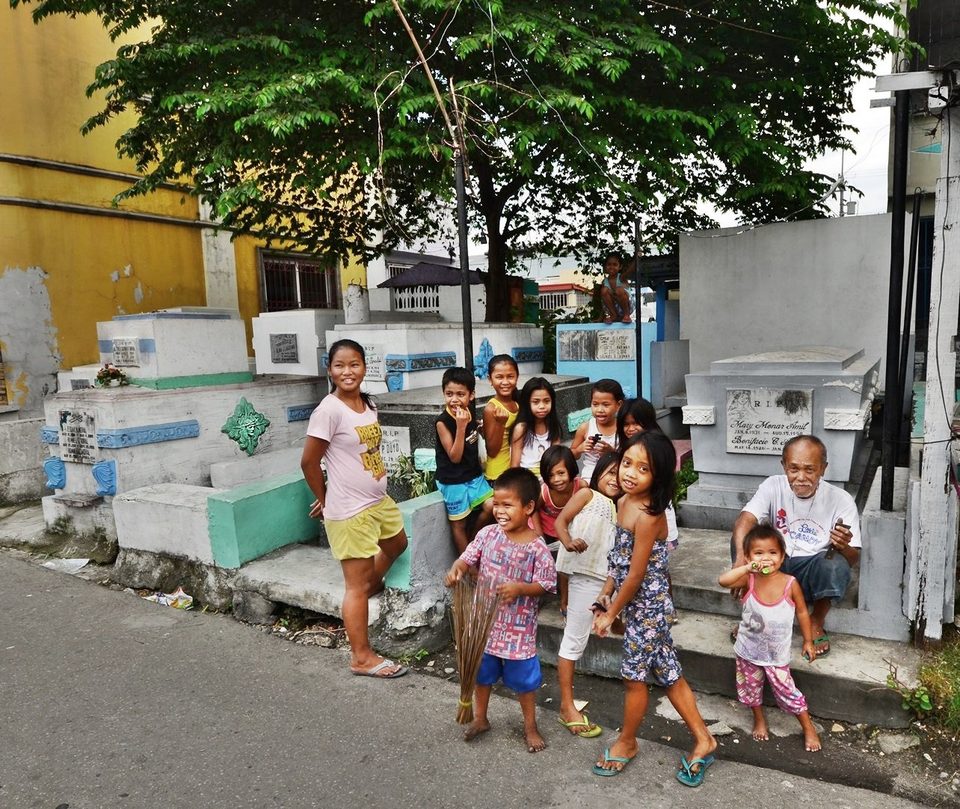 Three-generation of one family living at Manila North Cemetery