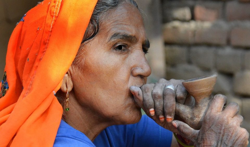 Abhaneri village woman and her clay pipe